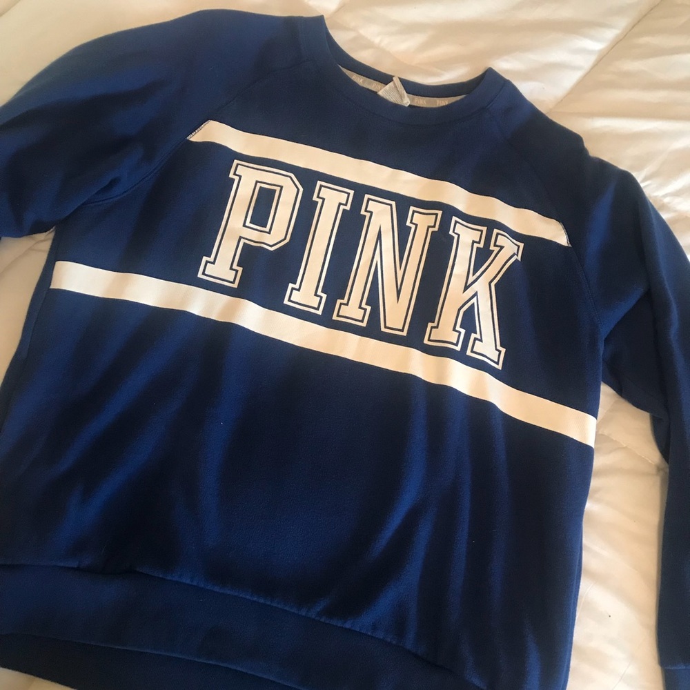 PINK crewneck sweatshirt.